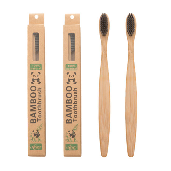 Bamboo toothbrush with wooden bamboo handle and charcoal bristles for hotels and guesthouses