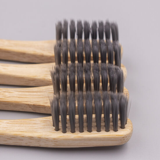 Custom biodegradable bamboo toothbrush with soft bristles and cylindrical bamboo handle for adults