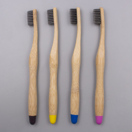 Custom biodegradable bamboo toothbrush with soft bristles and cylindrical bamboo handle for adults