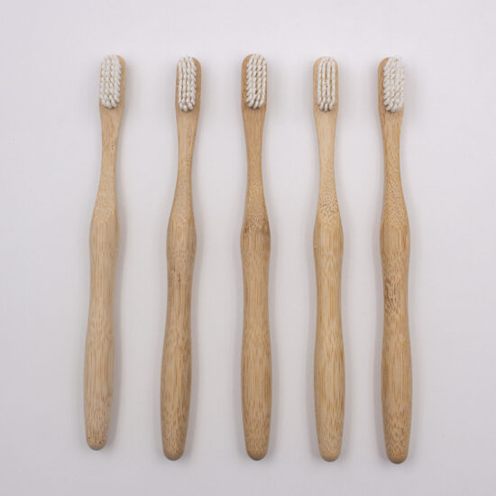 Custom biodegradable bamboo toothbrush with soft bristles and cylindrical bamboo handle for adults