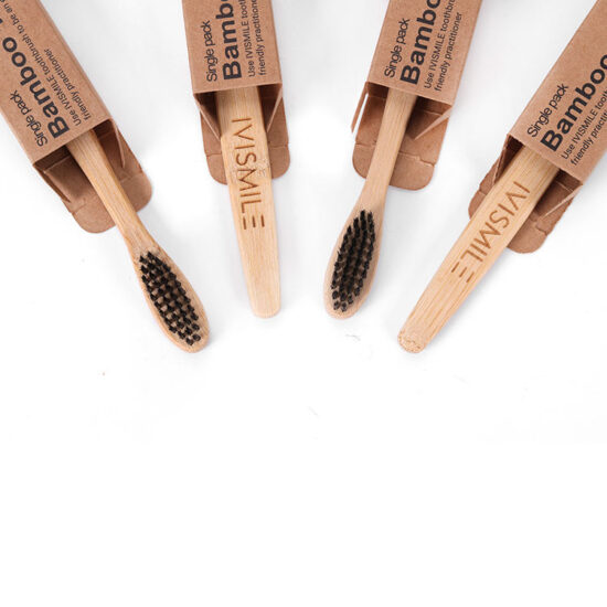 Eco-friendly bamboo toothbrush with flat round head and soft nylon bristles, portable design