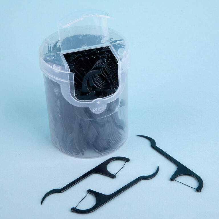 Curved bamboo charcoal dental floss picks for effective interdental cleaning, disposable and boxed for family use