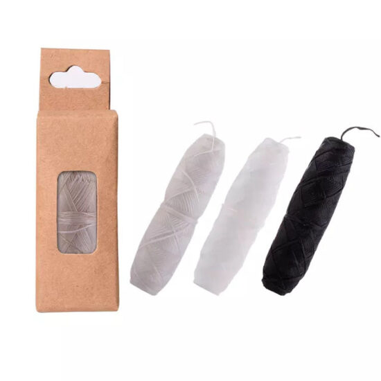 Mint-flavored charcoal and corn fiber dental floss in glass bottle with kraft box