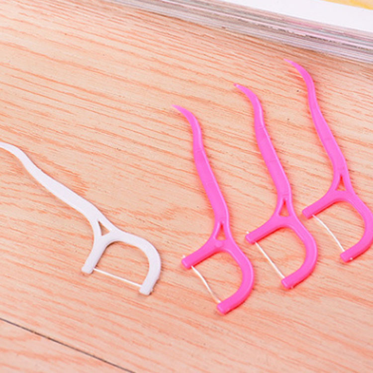 Plastic bag packed disposable dental floss picks for oral hygiene and interdental cleaning