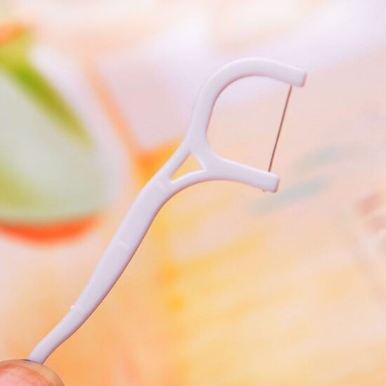 Plastic bag packed disposable dental floss picks for oral hygiene and interdental cleaning