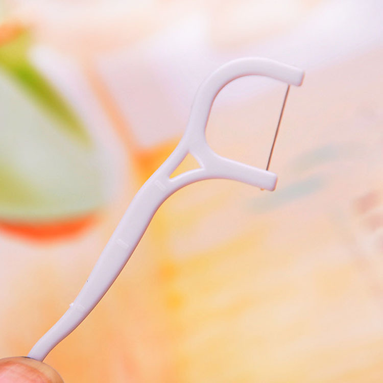 Plastic bag packed disposable dental floss picks for oral hygiene and interdental cleaning