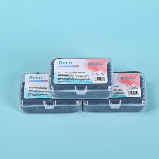 Bamboo charcoal floss picks for oral hygiene in plastic box packaging