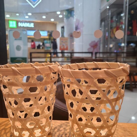 Handwoven bamboo tube milk tea cup with unique bamboo basket design