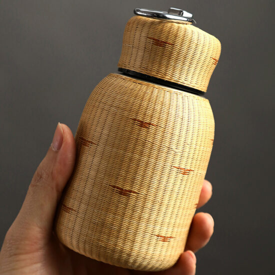 Porcelain bamboo-woven insulated tea cup with lid and stainless steel liner