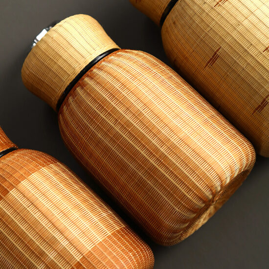 Porcelain bamboo-woven insulated tea cup with lid and stainless steel liner