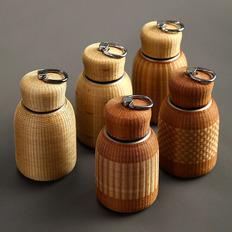 Porcelain bamboo-woven insulated tea cup with lid and stainless steel liner