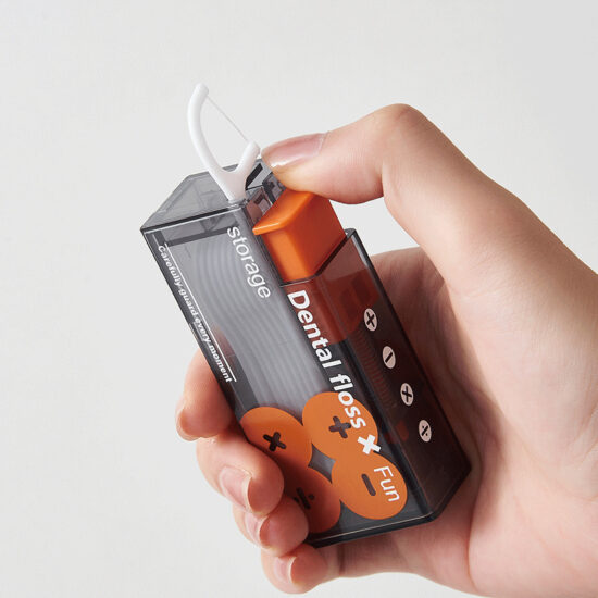 Press-type dental floss pick dispenser with disposable floss sticks for travel use
