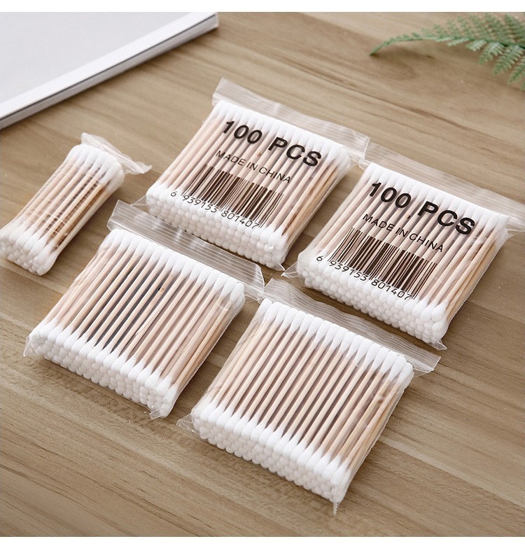 Sterile double-ended cotton swabs with wooden sticks and large tips for baby care and makeup removal