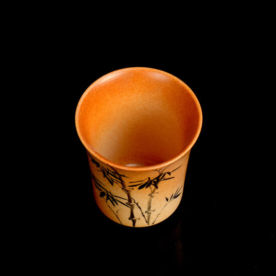 Handmade wood-fired ceramic tea cup with bamboo bell shape and brushwork