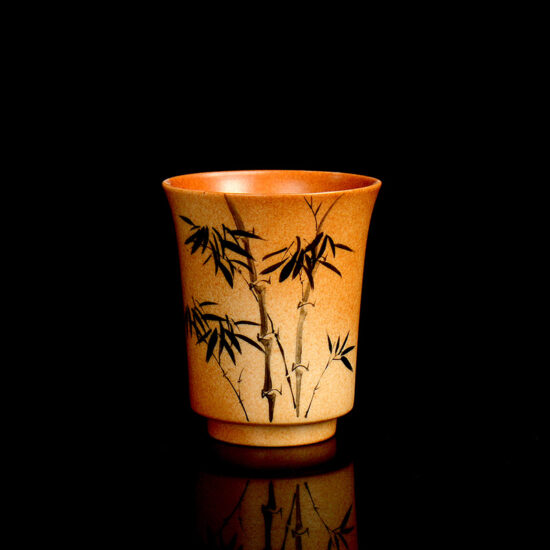 Handmade wood-fired ceramic tea cup with bamboo bell shape and brushwork